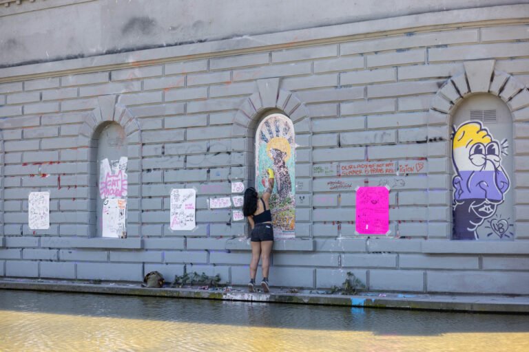 ‘Let the people have rat’ — Work party restores Cal Anderson Park mural